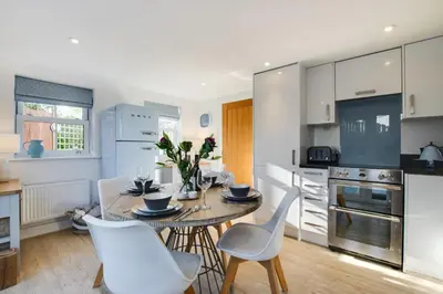 a kitchen with a table and chairs in a room at 2 Bed in St. Merryn oc-p00607 in St Merryn