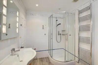a bathroom with a glass shower and a sink at 5 Bed in Padstow oc-p00628 in Padstow