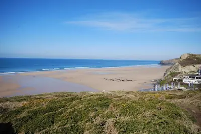 a view of a beach with a house and the ocean at 3 Bed in Newquay oc-p00631 in Newquay