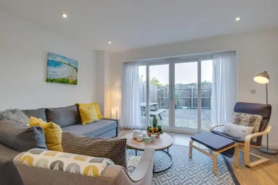 a living room with a couch and a table at 3 Bed in Newquay oc-p00631 in Newquay