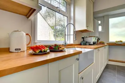 a kitchen with a bowl of fruit on a counter at 2 Bed in Padstow oc-p00632 in Padstow