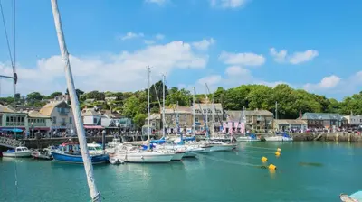 a bunch of boats are docked in a harbor at 1 Bed in St. Merryn oc-p00645 in St Merryn