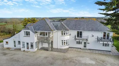 an aerial view of a large white house at 1 Bed in St. Merryn oc-p00645 in St Merryn