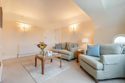 a living room with a couch and a table at 1 Bed in St. Merryn oc-p00645 in St Merryn