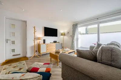 a living room with a couch and a tv at 2 Bed in Padstow oc-p00655 in Padstow