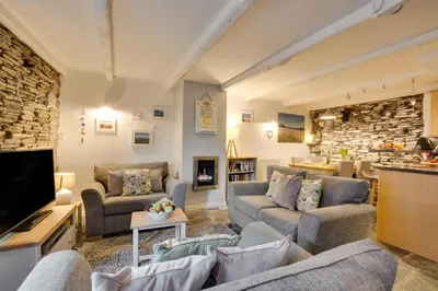 a living room with two couches and a tv at 2 Bed in Padstow oc-p00670 in Padstow