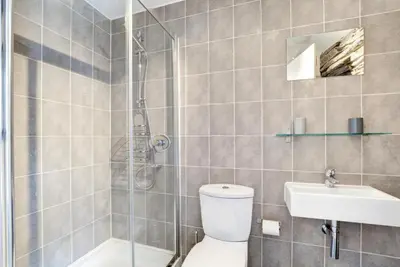 a bathroom with a shower and a toilet and a sink at 2 Bed in Padstow oc-p00670 in Padstow