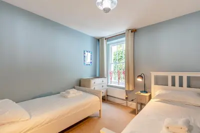 a bedroom with two beds and a window at 2 Bed in Fowey oc-p00671 in Fowey