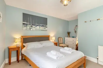 a bedroom with a bed with two towels on it at 2 Bed in Fowey oc-p00671 in Fowey