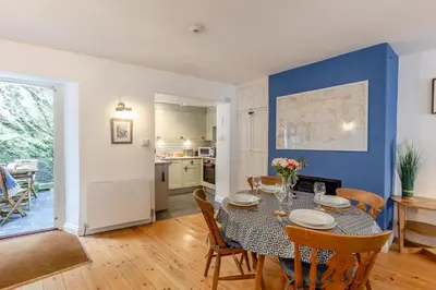 a kitchen and dining room with a table and chairs at 2 Bed in Fowey oc-p00671 in Fowey