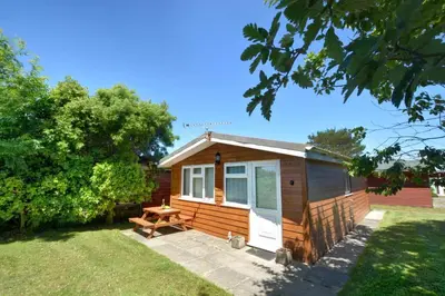 a tiny house with a picnic table in a yard at 2 Bed in St. Merryn oc-p00673 in St Merryn