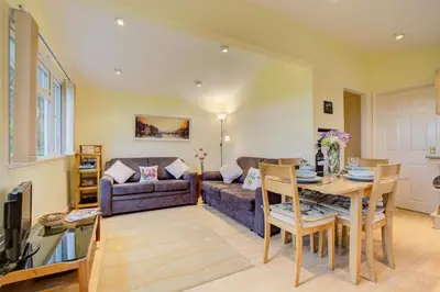 a living room with a couch and a table at 2 Bed in St. Merryn oc-p00673 in St Merryn