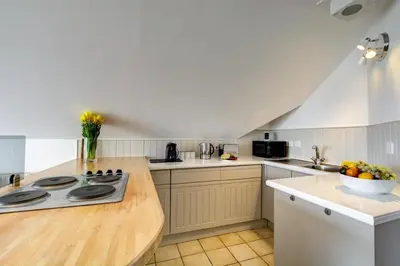 a kitchen with a stove and a bowl of fruit at 1 Bed in Padstow oc-p00685 in Padstow