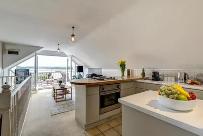 a kitchen with a bowl of fruit on a counter at 1 Bed in Padstow oc-p00685 in Padstow