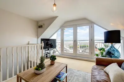 a living room with a couch and a table at 1 Bed in Padstow oc-p00685 in Padstow