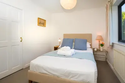 a bedroom with a bed with two towels on it at 4 Bed in Trevone oc-p00696 in Padstow