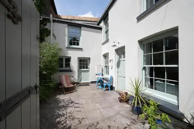 a patio with chairs and a table in a house at 2 Bed in Polruan oc-p00697 in Fowey