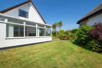 a view of the side of a house with a yard at 3 Bed in St. Merryn oc-p00700 in St Merryn