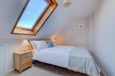 a bedroom with a bed and a skylight at 3 Bed in St. Merryn oc-p00700 in St Merryn