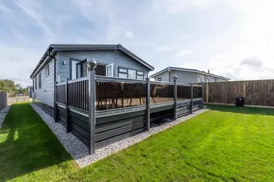 a tiny house with a deck in a yard at 3 Bed in St. Merryn oc-p00701 in St Merryn