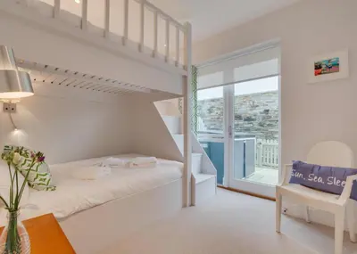 a bedroom with a bunk bed and a window at 2 Bed in Fowey oc-p00703 in Fowey