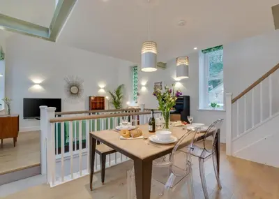 a dining room with a wooden table and chairs at 2 Bed in Fowey oc-p00703 in Fowey