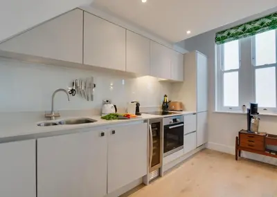 a kitchen with white cabinets and a sink at 2 Bed in Fowey oc-p00703 in Fowey