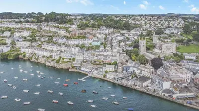 an aerial view of a city with boats in the water at 2 Bed in Fowey oc-p00708 in Fowey