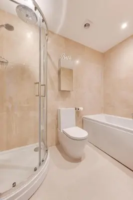 a bathroom with a toilet and a tub and a shower at 2 Bed in Fowey oc-p00708 in Fowey