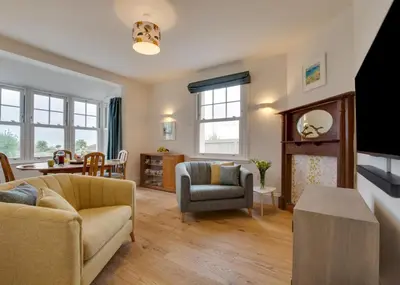 a living room with a couch and a chair at 4 Bed in Newquay oc-p00709 in Newquay