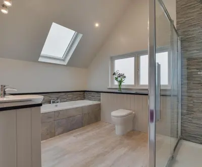 a bathroom with a shower and a toilet and a sink at 4 Bed in Newquay oc-p00709 in Newquay