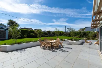 a patio with a table and chairs on it at 4 Bed in Newquay oc-p00709 in Newquay