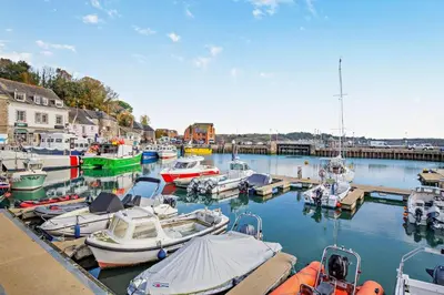 a bunch of boats are docked in a marina at 4 Bed in Padstow oc-p00718 in Padstow
