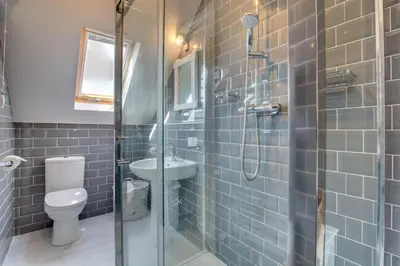 a bathroom with a shower and a toilet and a sink at 1 Bed in Padstow oc-p00730 in Padstow