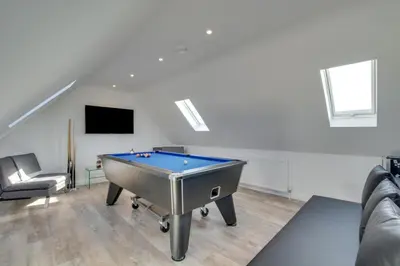 a pool table in a living room with a tv at 5 Bed in Little Petherick oc-p00736 in Little Petherick