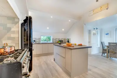 a kitchen with a stove and a counter top at 3 Bed in Trevone oc-p00758 in St Merryn