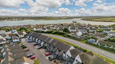 an aerial view of a town with a river and houses at 4 Bed in Padstow oc-p00759 in Padstow