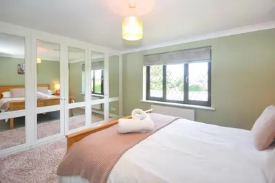 a bedroom with a bed with a towel on it at 4 Bed in Padstow oc-p00759 in Padstow