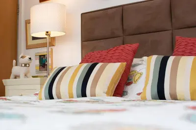 a bedroom with a bed with two pillows and a lamp at 3 Bed in Padstow oc-p00797 in Padstow