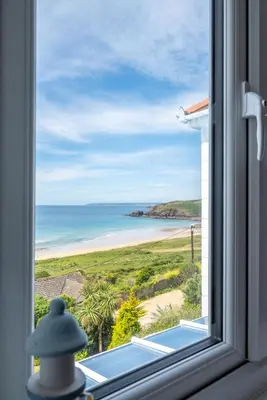 a window with a view of the beach at 3 Bed in Praa Sands oc-p00859 in Praa Sands