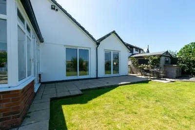 an image of a house with a yard at 4 Bed in Trevone oc-p00863 in Padstow