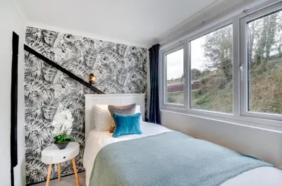 a small bedroom with a bed and a window at 2 Bed in Fowey oc-p00873 in Fowey