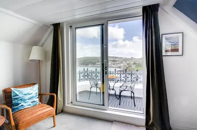 a room with a window with a view of a balcony at 2 Bed in Fowey oc-p00873 in Fowey