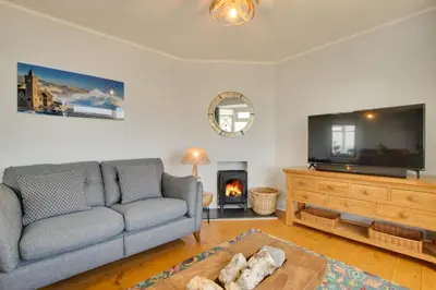 a living room with a couch and a tv and a fireplace at 3 Bed in Porthleven oc-p00877 in Porthleven