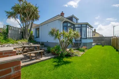 a garden with a picnic table and a house at 3 Bed in Porthleven oc-p00877 in Porthleven
