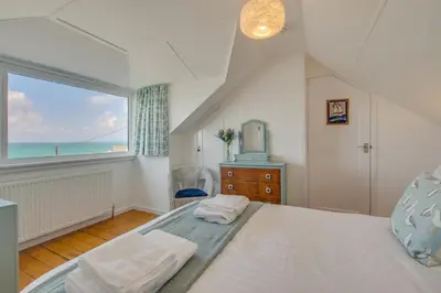 a bedroom with a bed and a large window at 3 Bed in Porthleven oc-p00877 in Porthleven