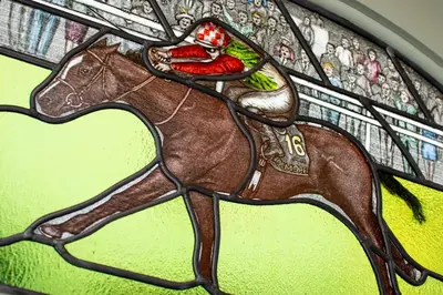 a stained glass window of a person riding a horse at 3 Bed in Padstow oc-p00807 in Padstow