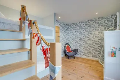 a room with a staircase and a chair at 3 Bed in Padstow oc-p00807 in Padstow