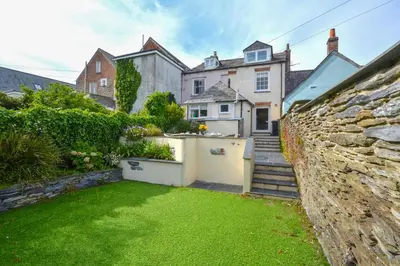 a house with a garden and a yard with grass at 3 Bed in Padstow oc-p00807 in Padstow