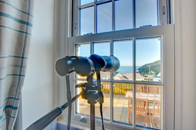 a camera on a tripod in front of a window at 3 Bed in Gorran Haven oc-p00812 in Gorran Haven